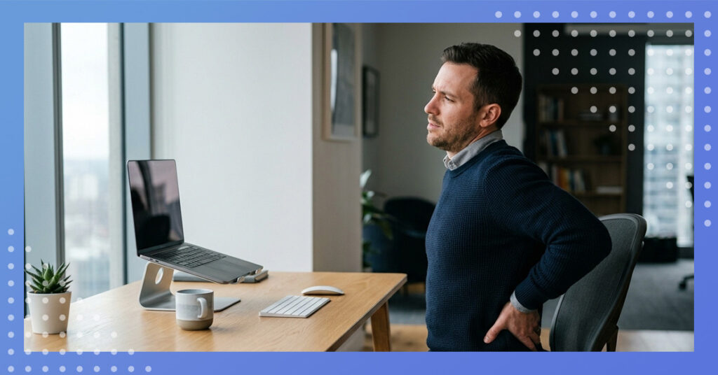 Man at desk with a sore back.